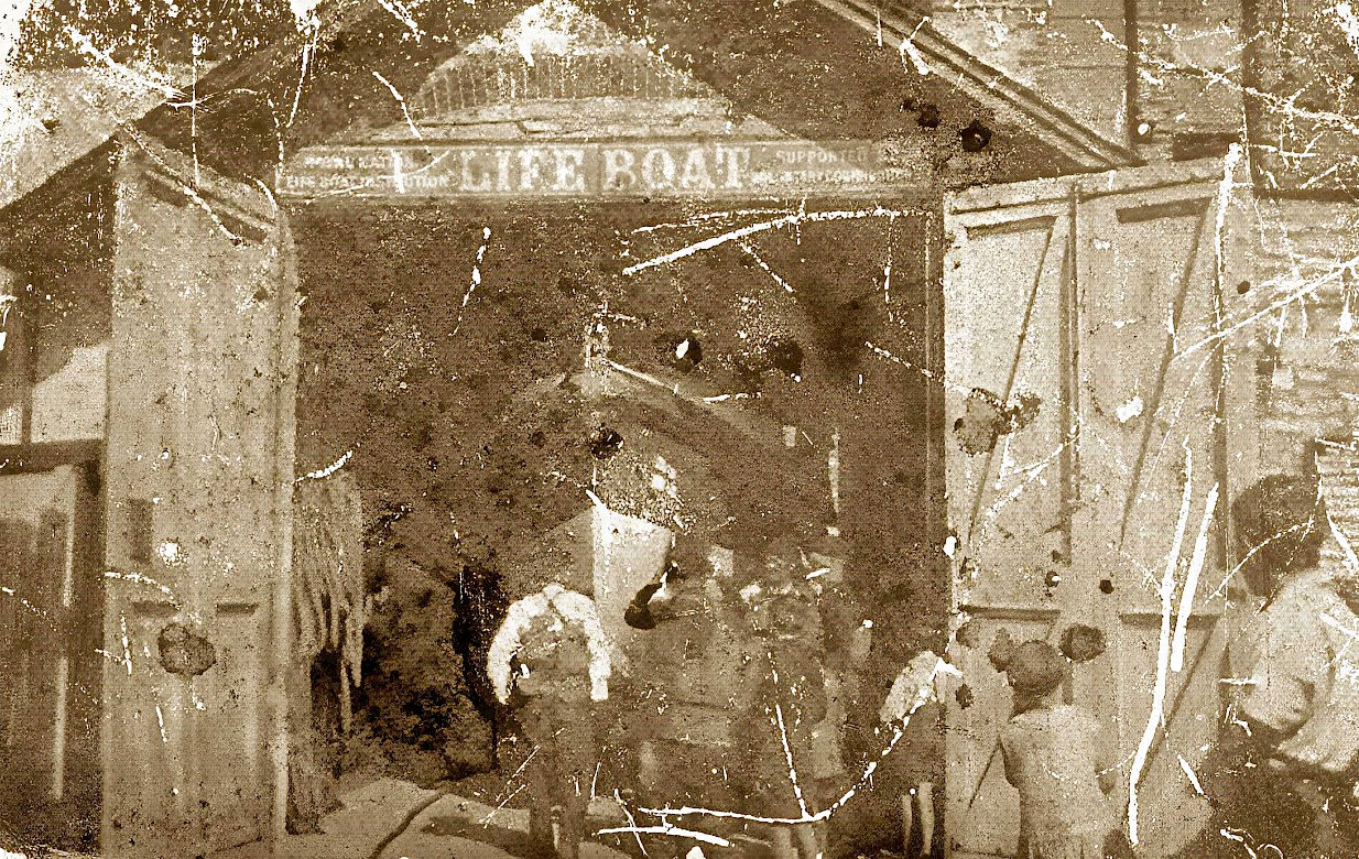 Badly damaged image of the boathouse with Ryder barely discernable within